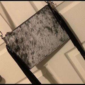 Black and white hair on hide crossbody.